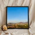 Wide Blue Sky Over a Hillside Town
